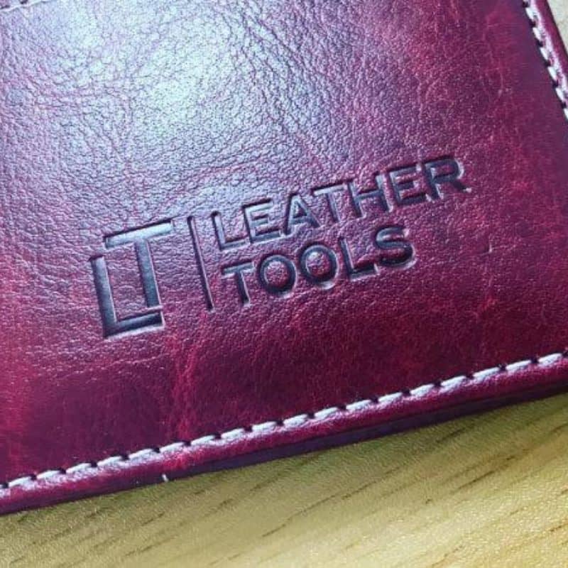 Debossed MHERDER logo on a leather gift