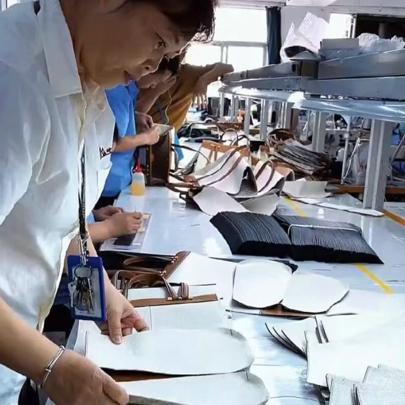 Leather patterns being inspected at a production workbench